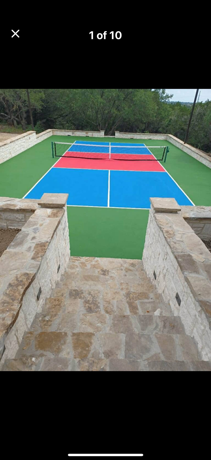 Concrete sport court with stone walls