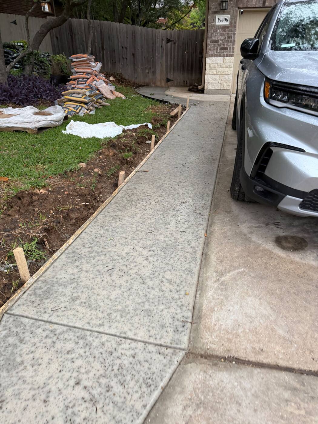 Rock salt finish concrete side walkway