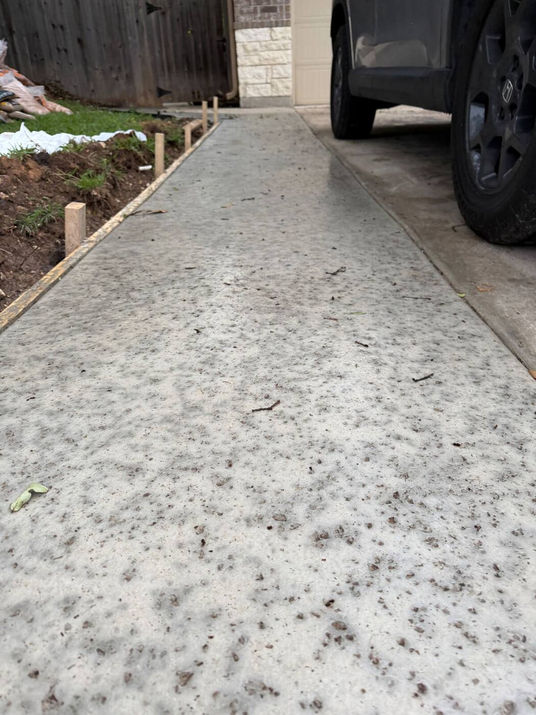 Rock salt finish concrete driveway extension