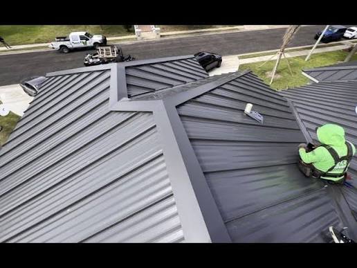 Charcoal seamless steel roof installation